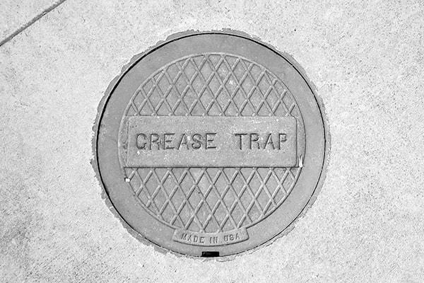 if you notice foul odors, slow drainage, or backups in your kitchen drains, it's time for grease trap pumping